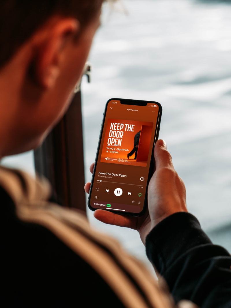 Man Holding iPhone Mockup